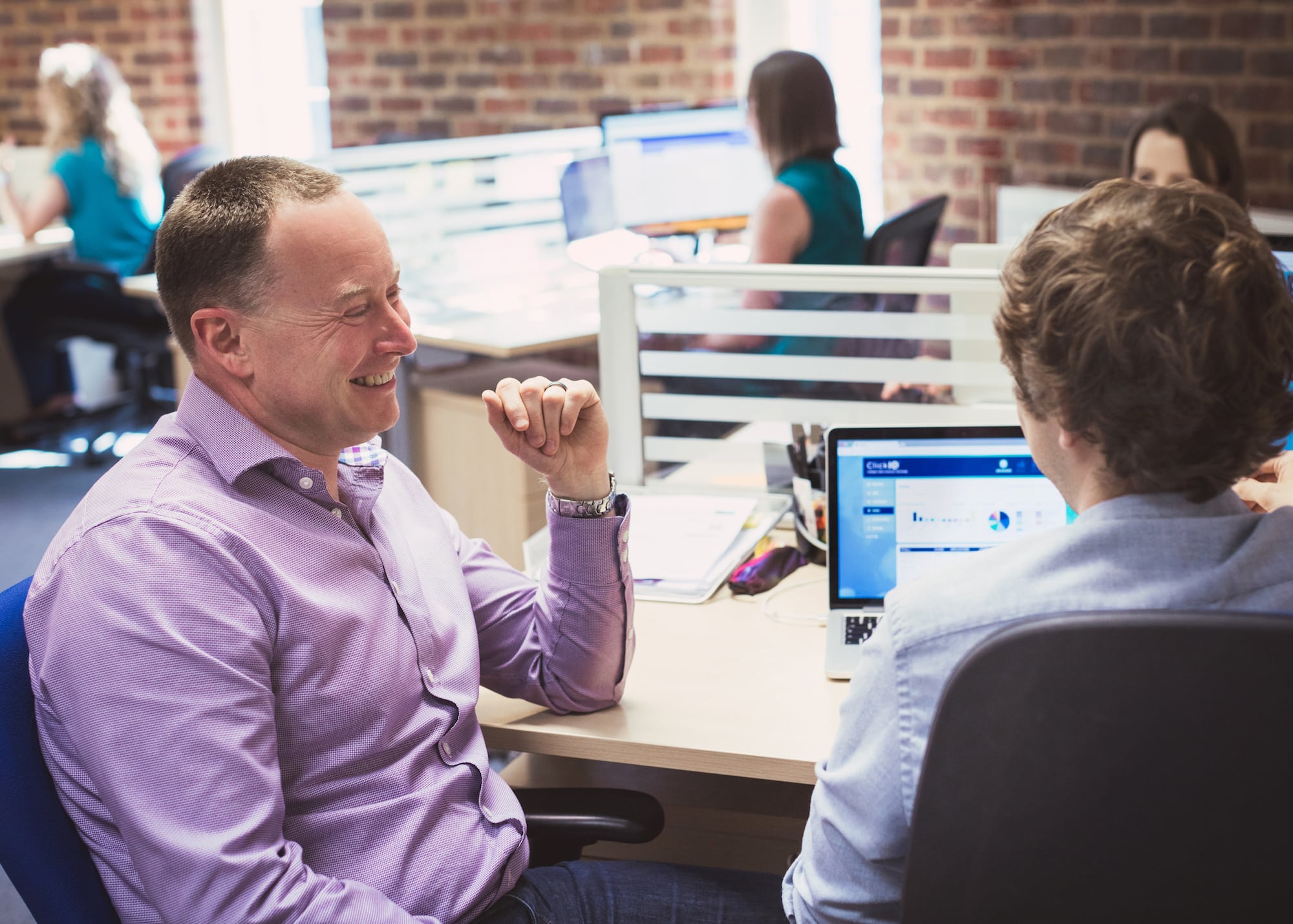 wellbeing in the workplace, colleagues provide support and enjoy working life
