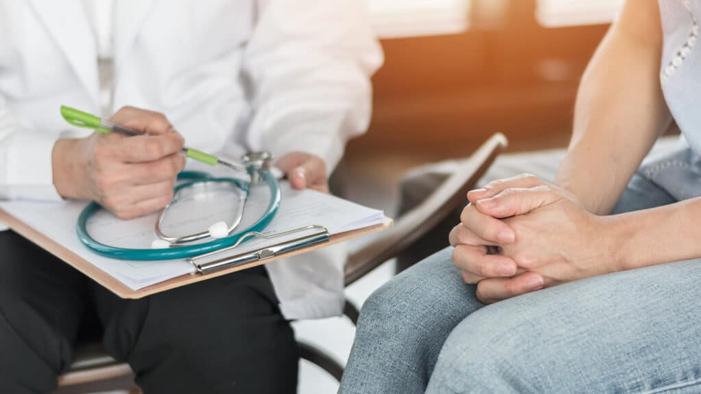 doctor or psychiatrist consulting and diagnostic examining stressful woman patient on obstetric gynecological female illness, or mental health in medical clinic or hospital healthcare service center